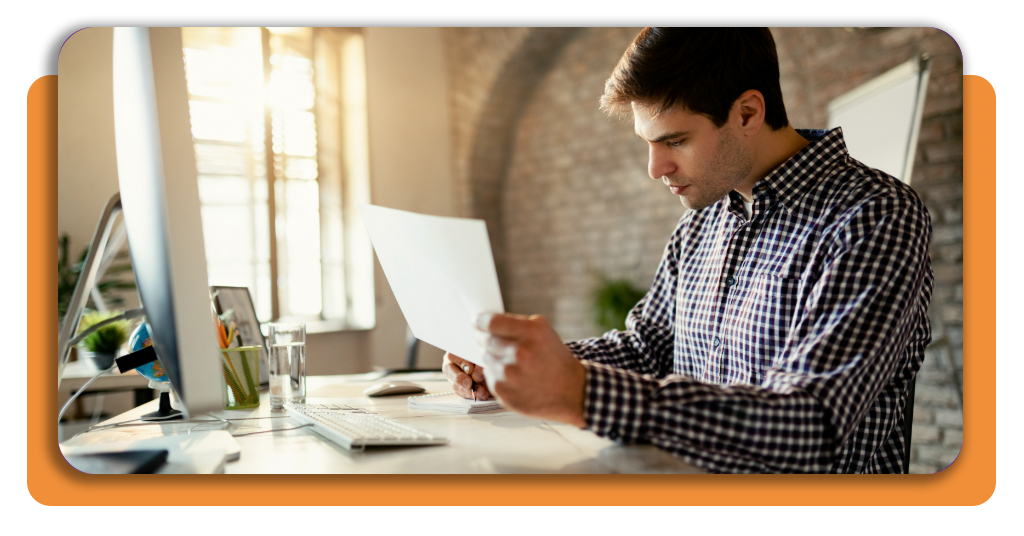 Employee checking paycheck records on a laptop