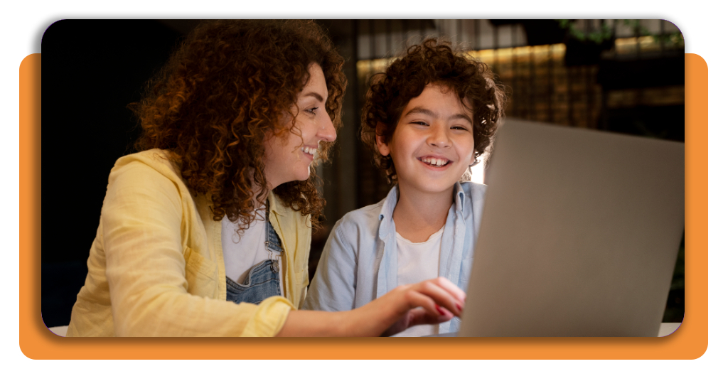 A child in an online class next to their mother